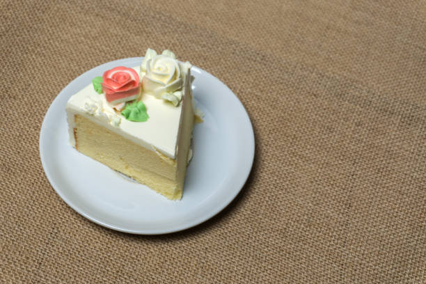 istock butter cake on white disc with sackcloth background. 642236656