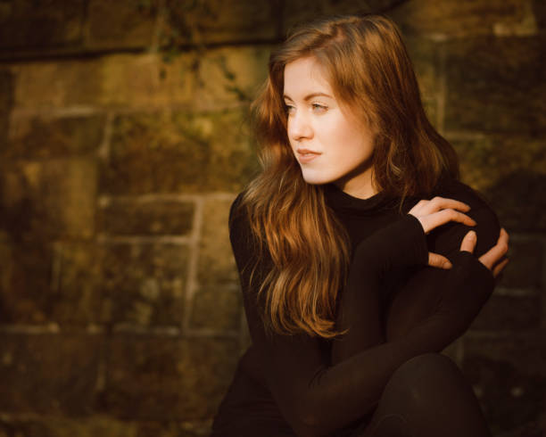 istock Beautiful young woman in black 642238910