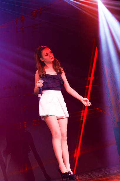 istock Female thai clubsinger on stage 642239062