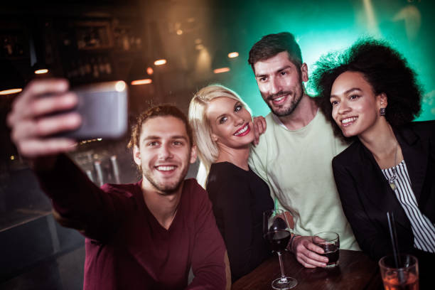 istock Group of people taking a selfie 642239516