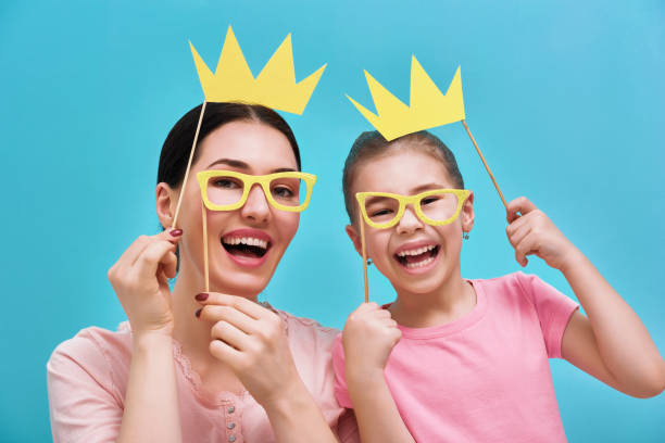 istock Mom and child are holding crowns 642242986