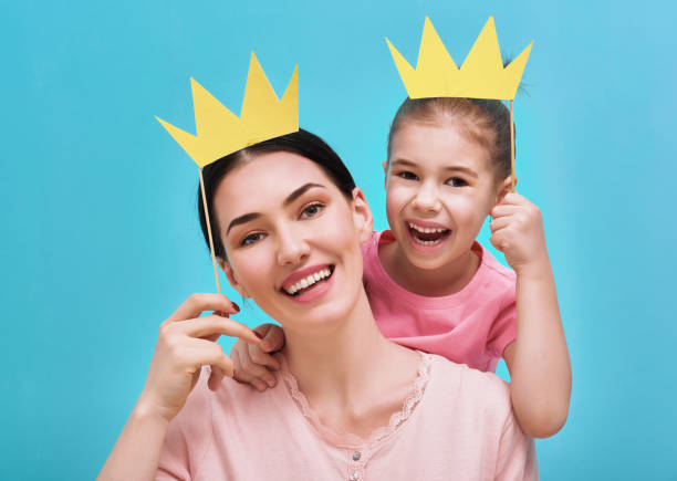 istock Mom and child are holding crowns 642242990