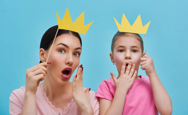 istock Mom and child are holding crowns 642242998