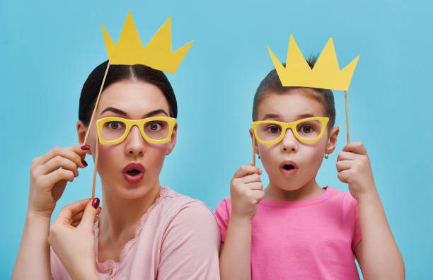 istock Mom and child are holding crowns 642243022