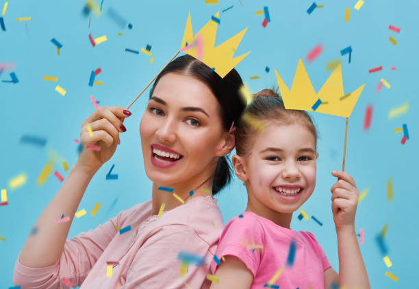 istock Mom and child are holding crowns 642243052