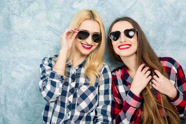 istock Female friends on the blue wall background 642246196
