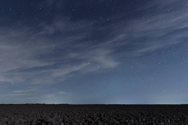 istock Cloudy Night sky with stars. Night background. Night sky. 642254054