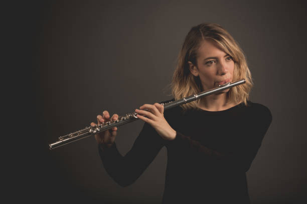 istock Woman Playing a Flute 642254660