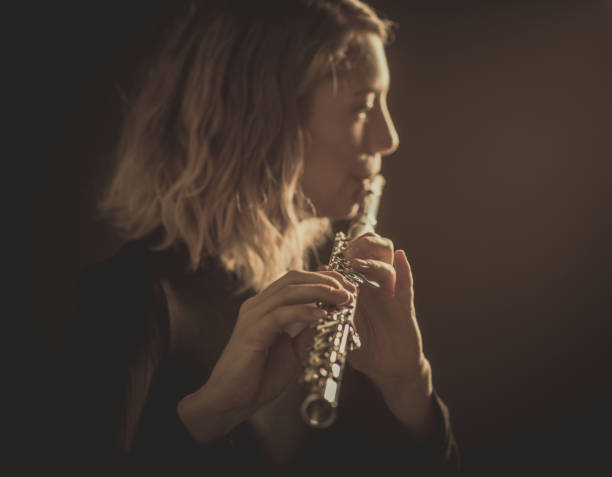 istock Woman Playing Music on a Flute 642254690