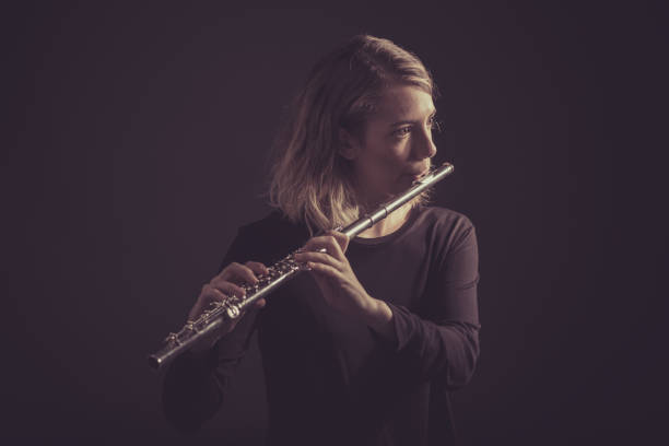 istock Woman playing a flute 642254724