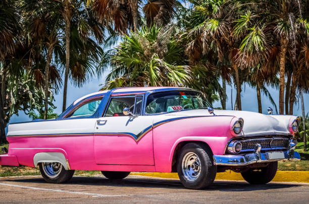 HDR  Beautiful American pink white vintage car in Varadero Cuba stock photo