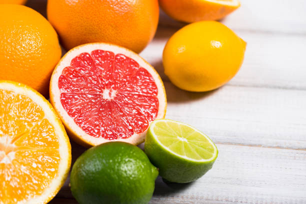 istock Fresh citrus fruits on a brown wooden table 642262862