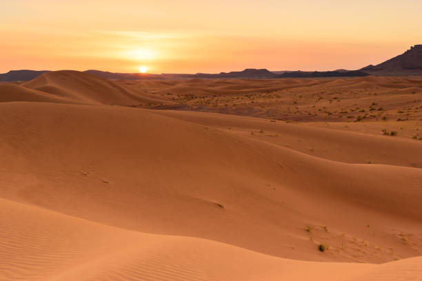 istock Ouzina sahara desert dunes sunset, Morocco 642270040