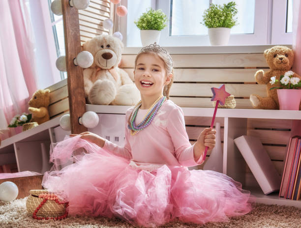 istock girl dresses up at home 642276522