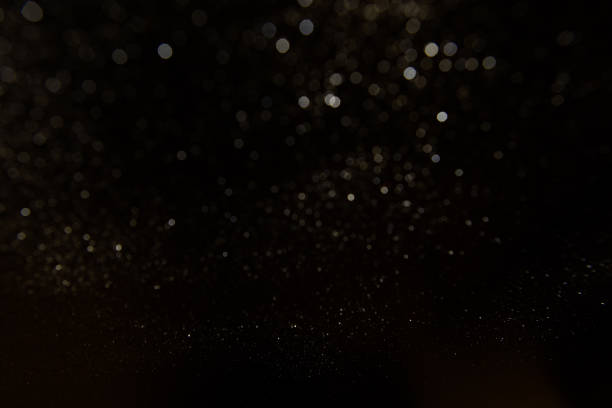 istock Abstract dark glitter lights texture or background.glitter wonderful lights background. 642285472