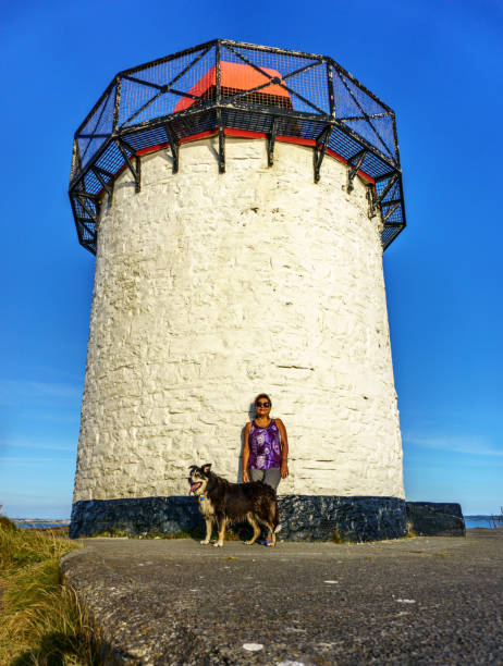 Outdoor lifestyle shoot of hispamnic enior woman at lighthouse