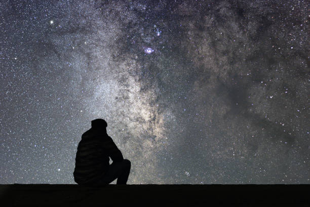 istock Man looking at the stars 642295414
