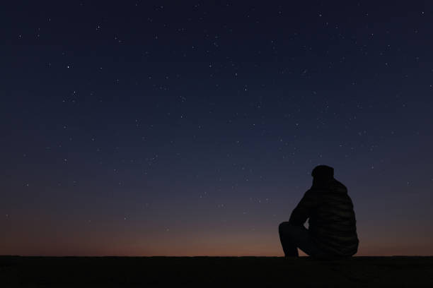istock Man looking at the stars 642295818