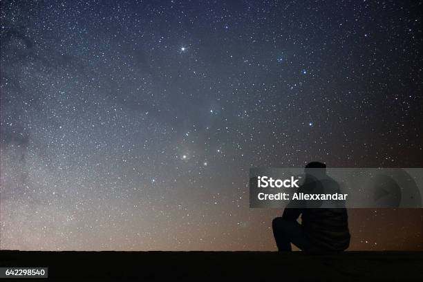 Man Looking At The Stars Stock Photo - Download Image Now - Looking, Star - Space, Star Shape