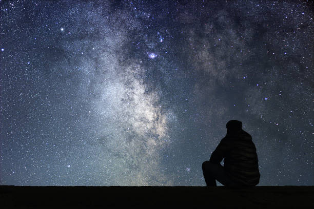 istock Man looking at the stars 642298738