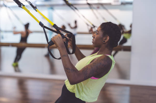 istock Group of Women Doing Barre + TRX Workout 642298992