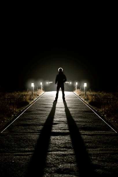 istock On man standing on a dark street 642312074