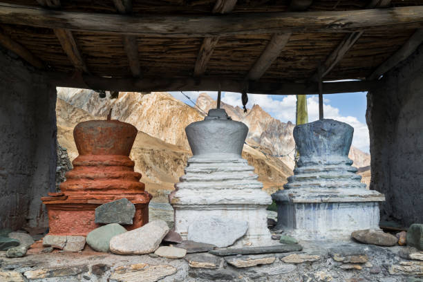 istock Three coloured stupas under a shed near Markha village 642315056