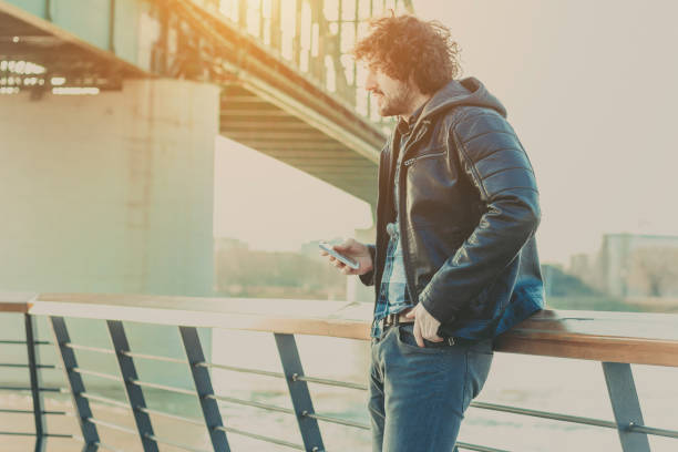 istock Handsome man using tablet in a center of city 642317246