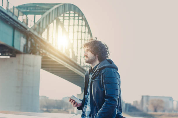 istock Handsome man using tablet in a center of city 642317506