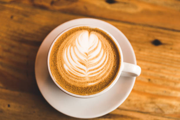 istock Perfect cappuccino in white cup on wood table 642323880