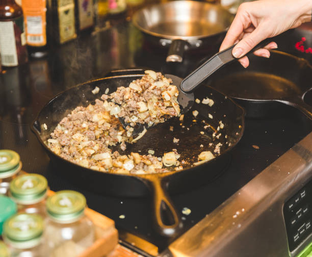 istock Cooking meat, potatoes, and veggies in skillet 642326930