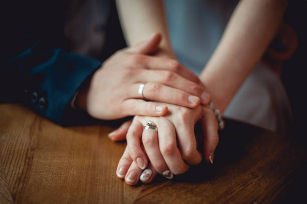 istock the couple holding hands 642327226