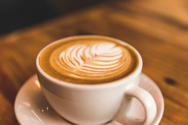 istock Perfect cappuccino in white cup on wood table 642327430