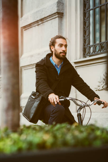 istock Businessman Riding Bicycle In City 642327438