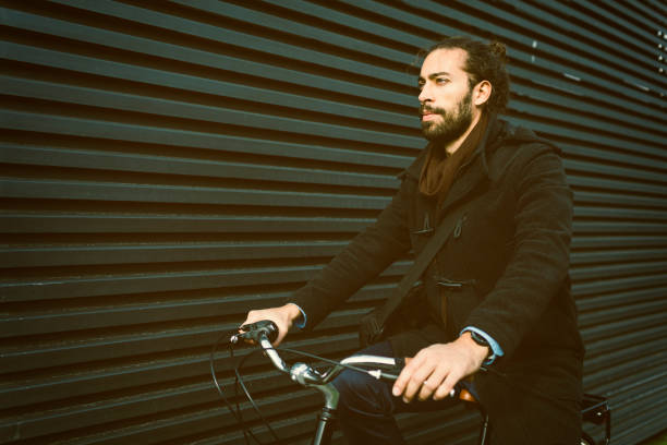 istock Businessman Riding Bicycle In City 642327738