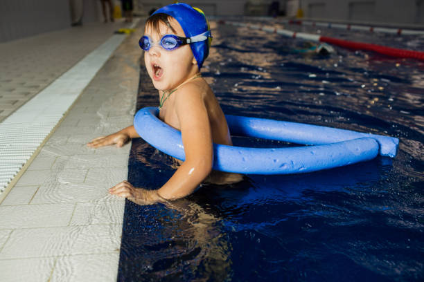 istock child in a swimming pool 642330374