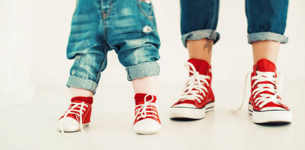 istock mothers and babys legs 642333212