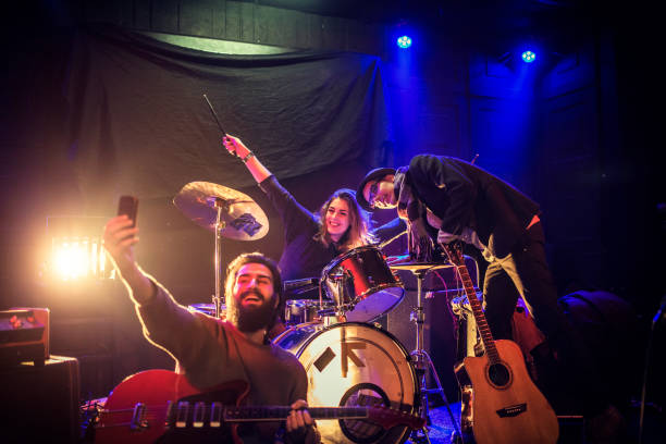 istock Friends from band taking selfie 642340584