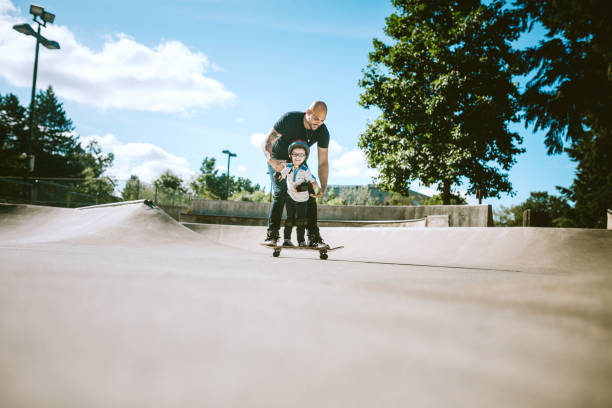 istock Father and Son at Skateboard Park 642360144
