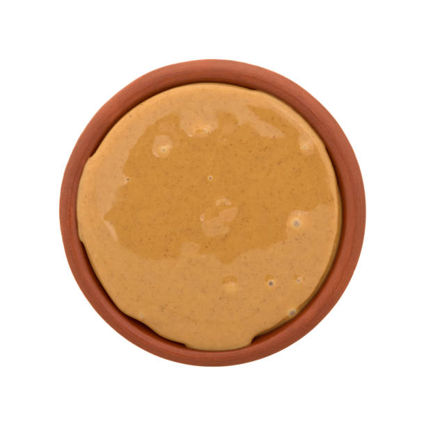 istock Bowl of peanut butter on a white background 642365400