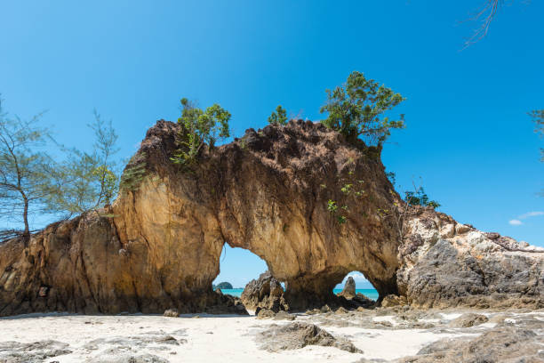 istock Rock formation on tropical beach 642369790