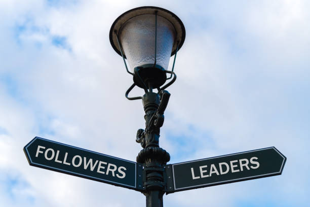 istock Followers versus Leaders directional signs on guidepost 642370084