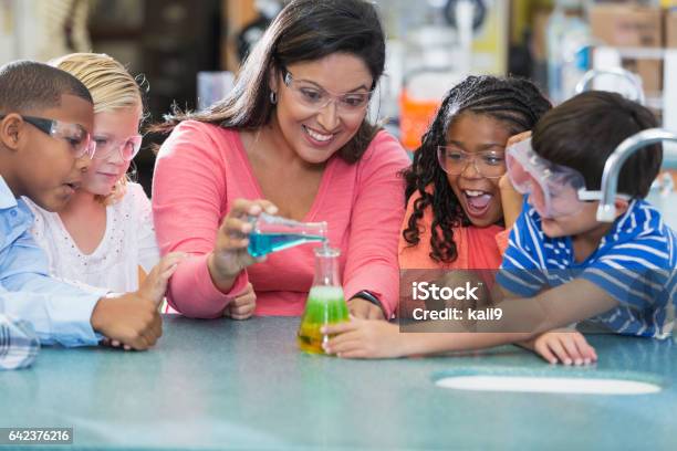 Multiethnic Teacher And Children In Science Lab Stock Photo - Download Image Now - Science, Teacher, Child