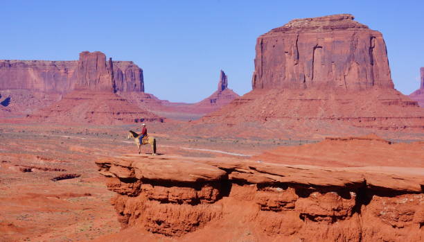 istock Horse rider in Monument valley. 642381886
