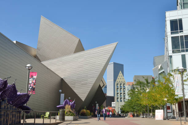 Denver, USA - September 19, 2015. People walking at Civic Center Cultural Complex in downtown Denver with Denver Art Museum on left, Colorado, USA.