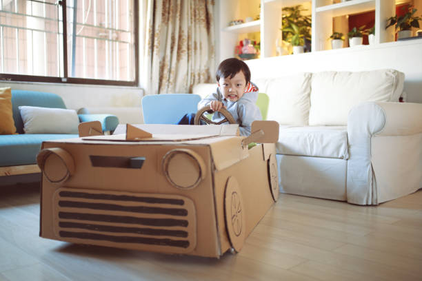 istock Children play in the cardboard car 642387990