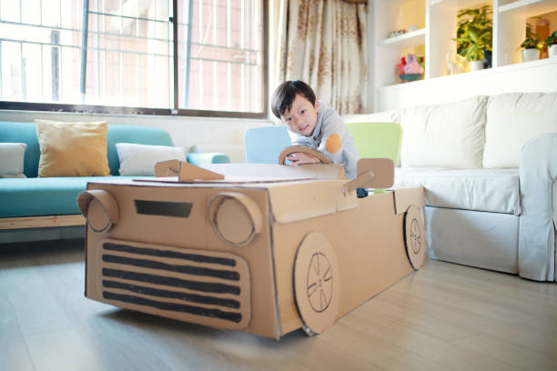istock Children play in the cardboard car 642388004