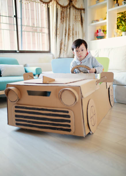 istock Children play in the cardboard car 642388026