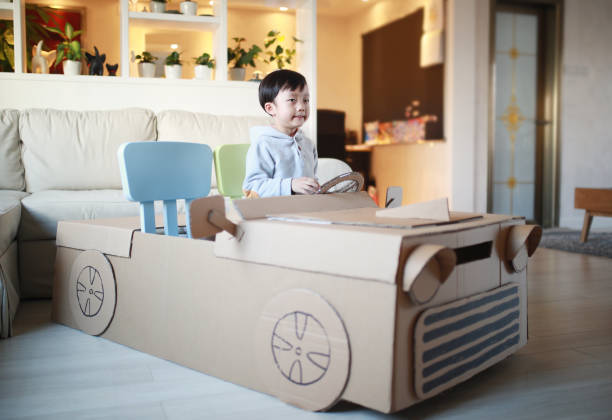 istock Children play in the cardboard car 642388164