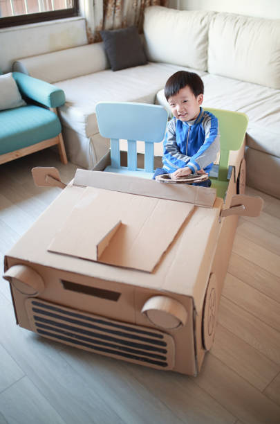 istock Children play in the cardboard car 642388202